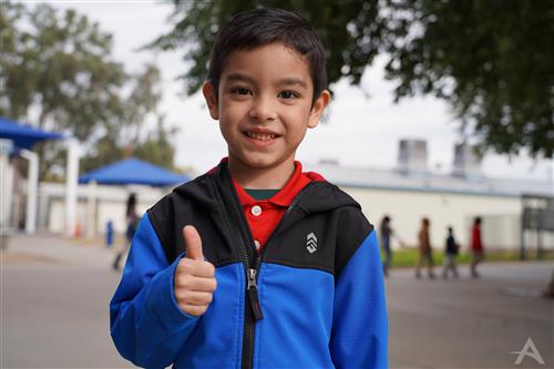Student with a thumbs up